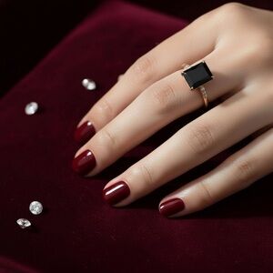 FAUX BLACK ONYX RING IN GOLD ACCENTED WITH 3 CUBIC ZIRCONIA STONES ON EACH SIDE